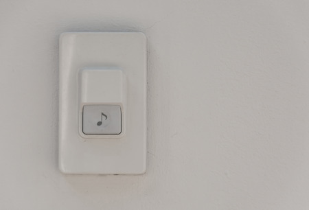 door bell on white wall