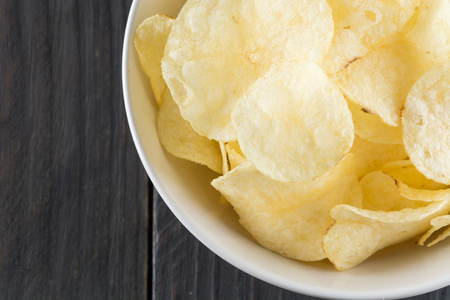 potato chips on wood backgroundの写真素材