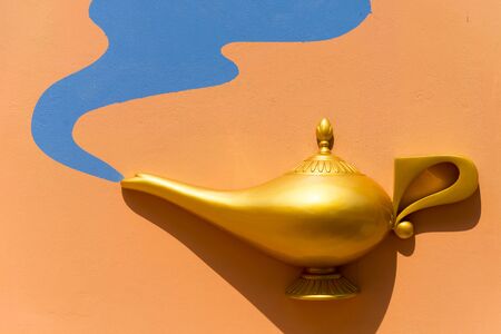 golden lamp on wall backgroundの写真素材