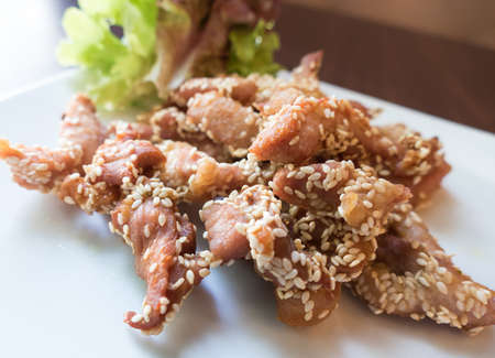 fried pork with white sesameの写真素材