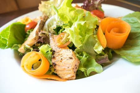 ceasar salad with grill salmonの写真素材
