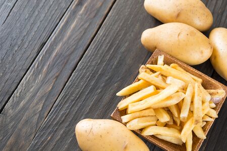 french fries on wood background