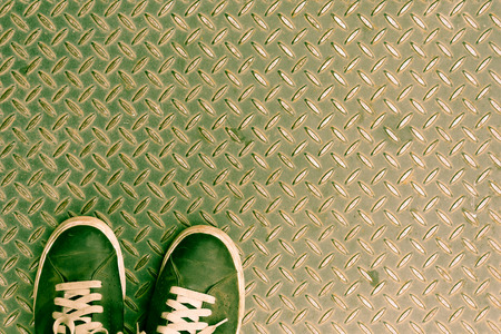 Shoes on Old metal steel background - vintage effect pictureの写真素材