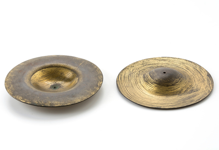 old cymbals on white backgroundの写真素材