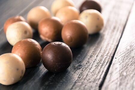 chocolate ball on wood backgroundの写真素材