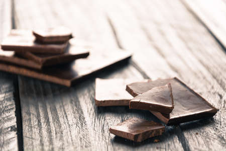 dark chocolate on wood backgroundの写真素材