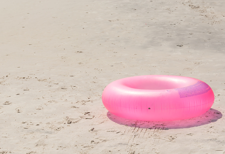 swim ring on the beachの写真素材