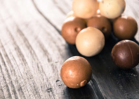 chocolate ball on wood backgroundの写真素材