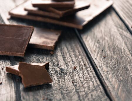 dark chocolate on wood backgroundの写真素材