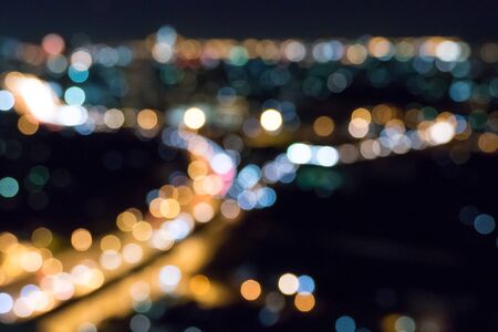 blurred bokeh night city scape in bangkokの写真素材