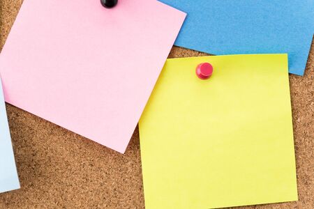 sticky note on cork board, empty space for text