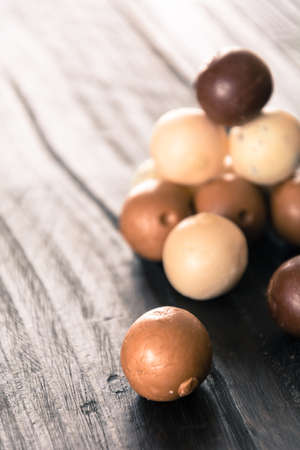 chocolate ball on wood backgroundの写真素材
