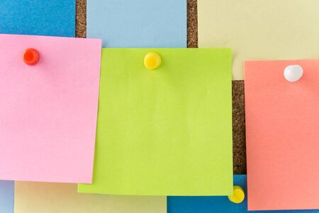 sticky note on cork board, empty space for text
