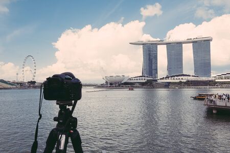 SINGAPORE-Jul 15, 2015: The Marina Bay Sands Resort in Singapore. The roofs of towers are decorated with a park in the form of a ship 340 m long and capacity up to 3,900 people - vintage effect pictureのeditorial素材
