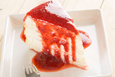 crape cake with strawberry sauceの写真素材
