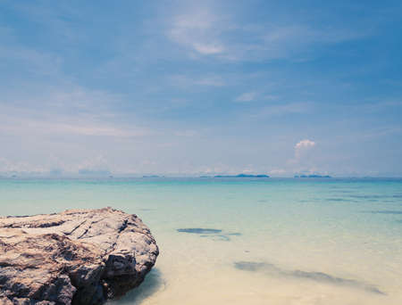 blue sky with sea and rock - soft focus with film filterの写真素材