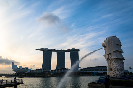 SINGAPORE, JUL 16 2015 : The Merlion and the Marina Bay Sands Resort Hotel, billed as the world's most expensive standalone casinoのeditorial素材