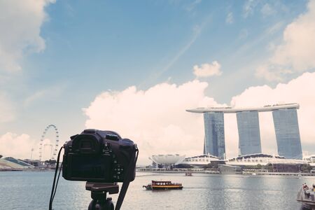 SINGAPORE-Jul 15, 2015: The Marina Bay Sands Resort in Singapore. The roofs of towers are decorated with a park in the form of a ship 340 m long and capacity up to 3,900 people - vintage effect pictureのeditorial素材