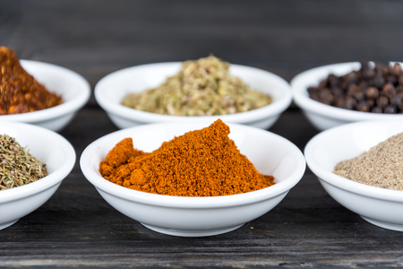 Spices and herbs in bowls. Food and cuisine ingredients.の写真素材