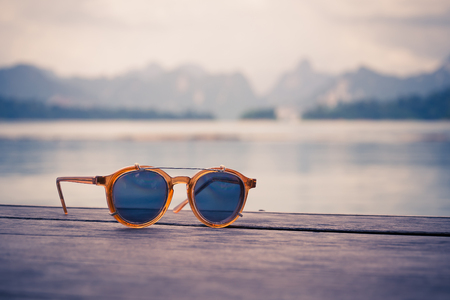 vintage sun glasses on woodの写真素材