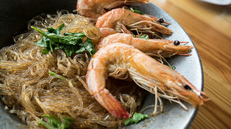 Casseroled prawns/shrimps with glass noodles.の写真素材