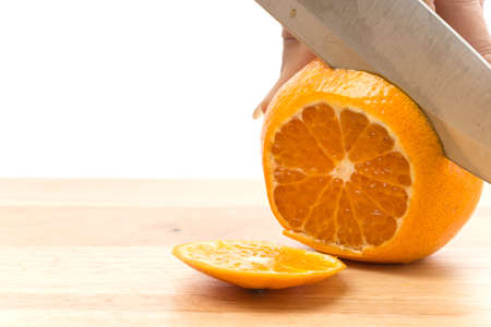 orange slice on wood boardの写真素材
