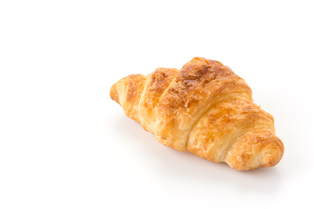 butter croissant on white backgroundの写真素材