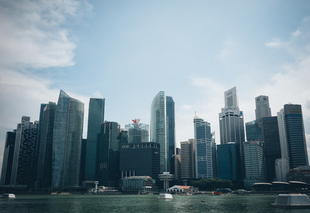 SINGAPORE, SINGAPORE - JULY 16 2015: View of downtown Singapore city. Singapore is one of the world's major commercial hubs.- with film filter effectのeditorial素材