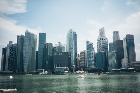 SINGAPORE, SINGAPORE - JULY 16 2015: View of downtown Singapore city. Singapore is one of the world's major commercial hubs.- with film filter effectのeditorial素材