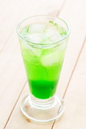 green soda on wood backgroundの写真素材
