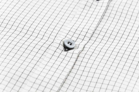 Close up of a button on shirtの写真素材