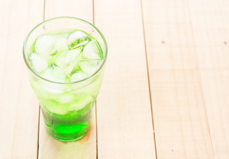 green soda on wood backgroundの写真素材