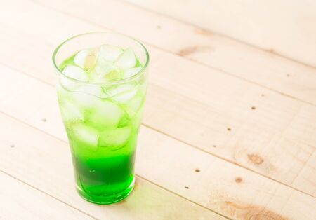green soda on wood backgroundの写真素材