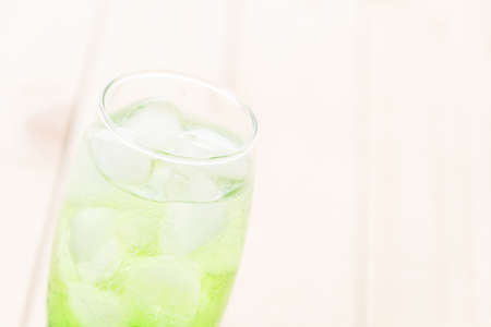 green soda on wood backgroundの写真素材