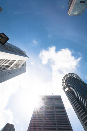 Skyscrapers with clouds and flareの写真素材