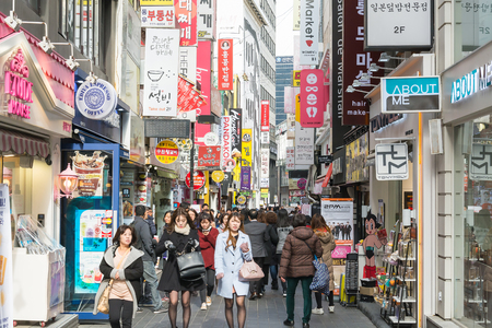 Seoul, South Korea - Nov 1, 2015: Crowds tourist at the Myeong-Dong street market. The location is the premiere district for shopping in Seoul city.のeditorial素材