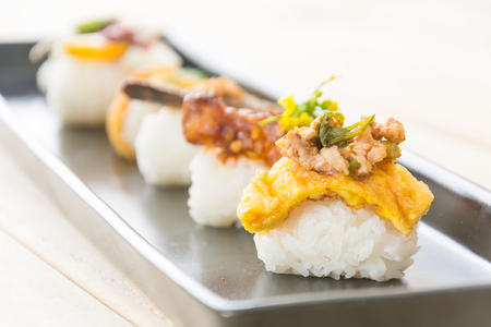 omelet with spicy pork sushi - fusion foodの写真素材