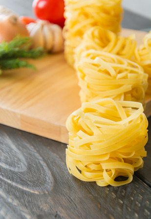 dry pasta spaghetti with ingredientの写真素材