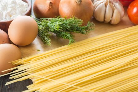 dry pasta spaghetti with ingredientの写真素材