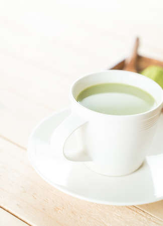 hot matcha latte on woodの写真素材