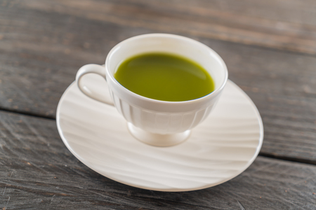 hot matcha on wood backgroundの写真素材
