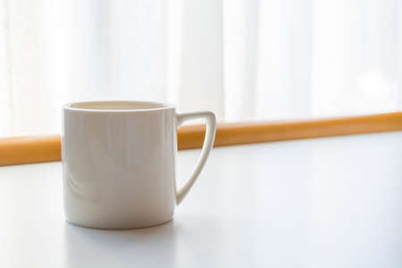 White coffee cup in coffee shop barの写真素材