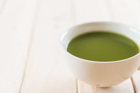 hot matcha on wood backgroundの写真素材