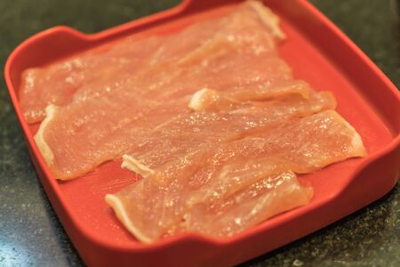 Fresh pork slice on plateの写真素材