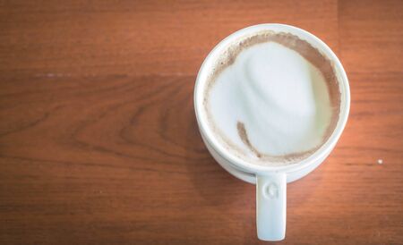 coffee cup in cafe - soft focus with vintage effect picture style