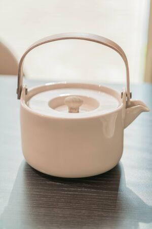 tea cup and teapot on table