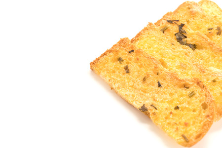 Garlic and herb bread slices on white backgroundの写真素材