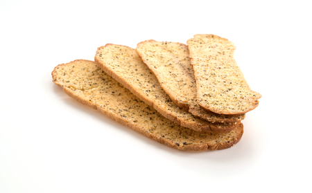 Garlic and herb bread slices on white backgroundの写真素材