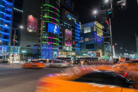 SEOUL, SOUTH KOREA - March 6 2016: People wander in the walking street of the Dongdaemun shopping...