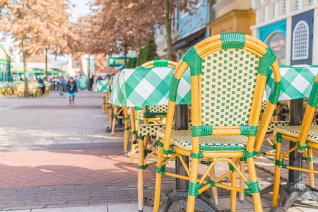 tables and chairs in outdoor restaurantの写真素材